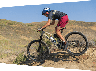 A person riding a bike on a dirt road. AI generated content